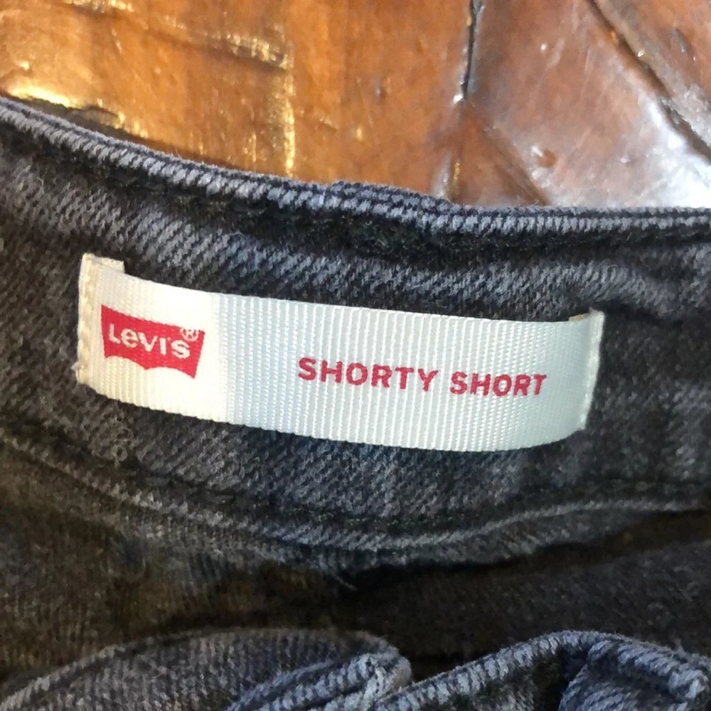 Levi’s girls black denim shorty shorts with lace up sides
